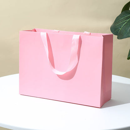 Solid-color gift tote bag¡ªminimalist, premium-feel, made of thickened white cardstock; suitable for jewelry box packaging