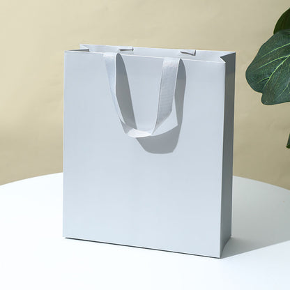 Solid-color gift tote bag¡ªminimalist, premium-feel, made of thickened white cardstock; suitable for jewelry box packaging
